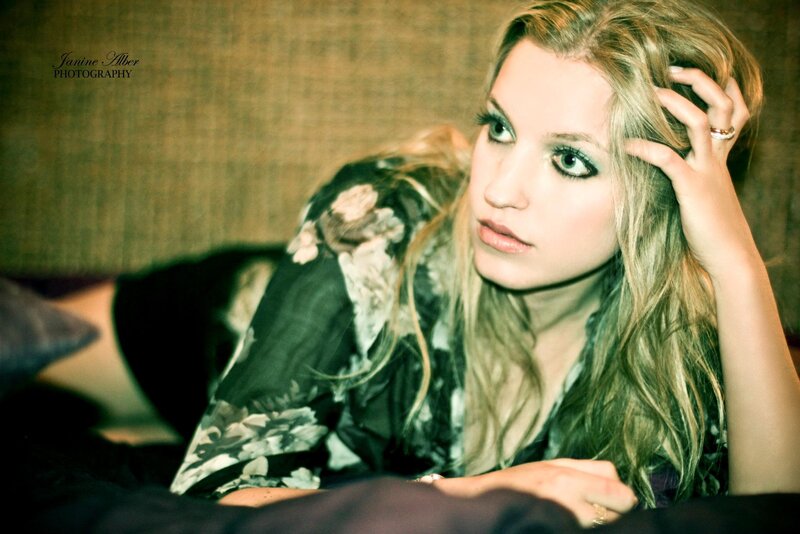 woman with blonde hair lying down