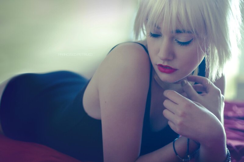woman with blonde hair lying down