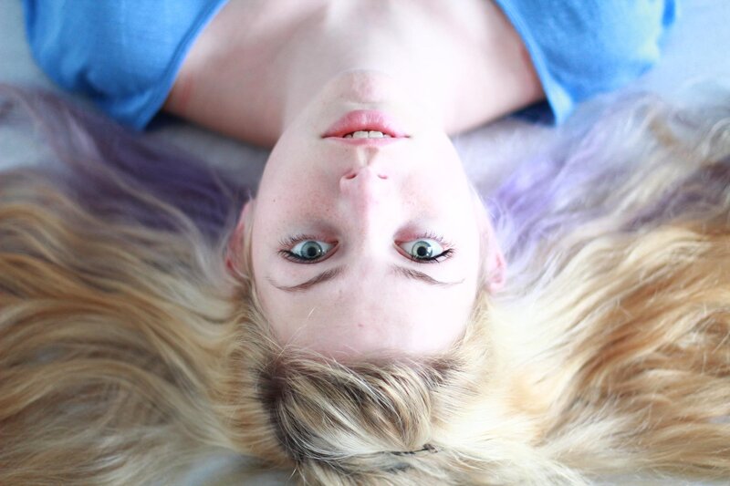 woman with blonde hair lying down
