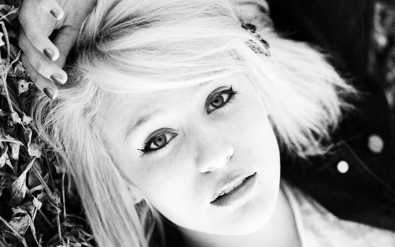 woman with blonde hair lying down