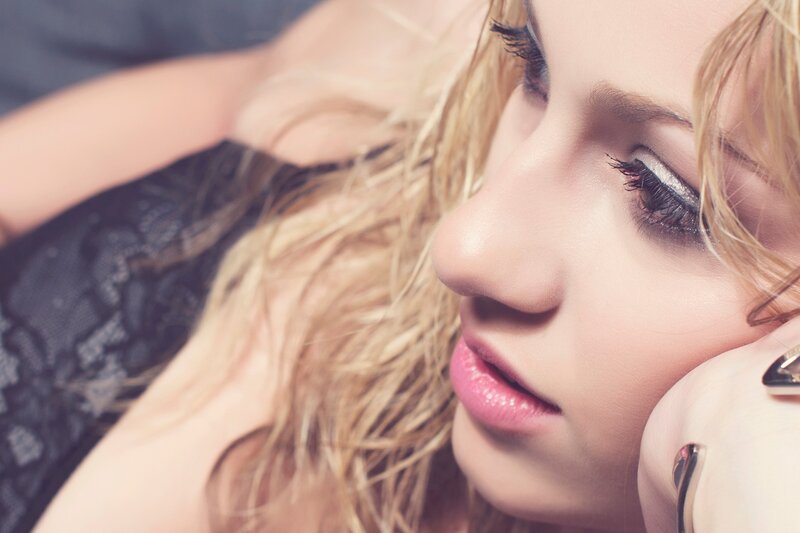 woman with blonde hair lying down