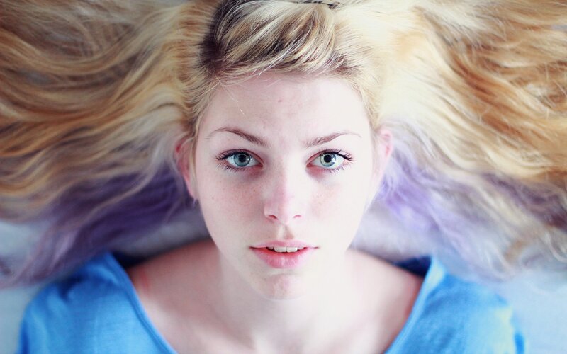 woman with blonde hair lying down