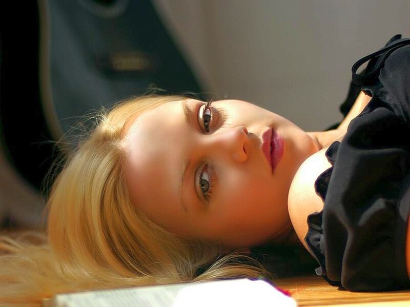 woman with blonde hair lying down