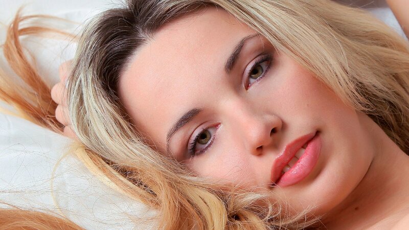 woman with blonde hair lying down