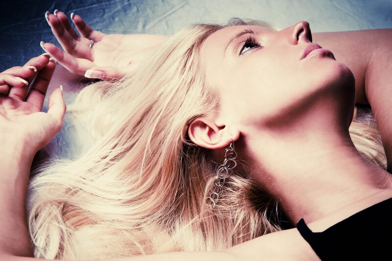 woman with blonde hair lying down