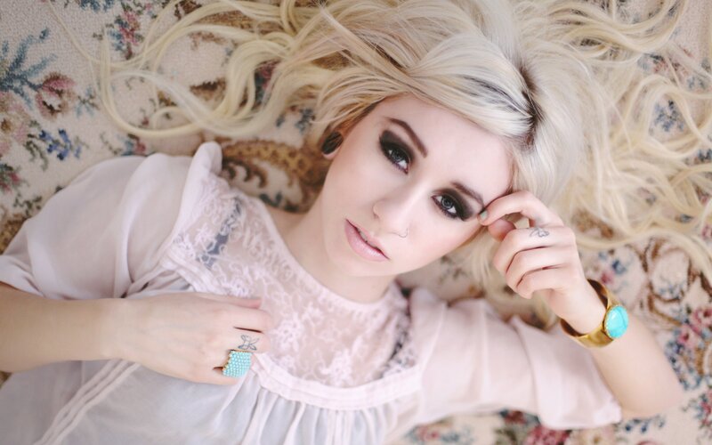 woman with blonde hair lying down
