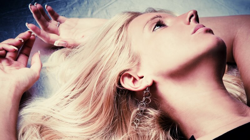 woman with blonde hair lying down