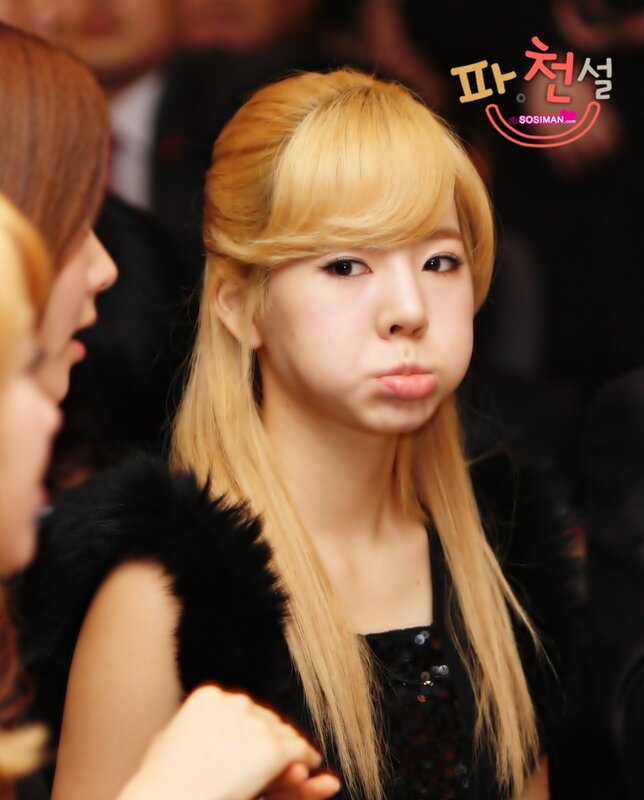 woman with blonde hair making a face