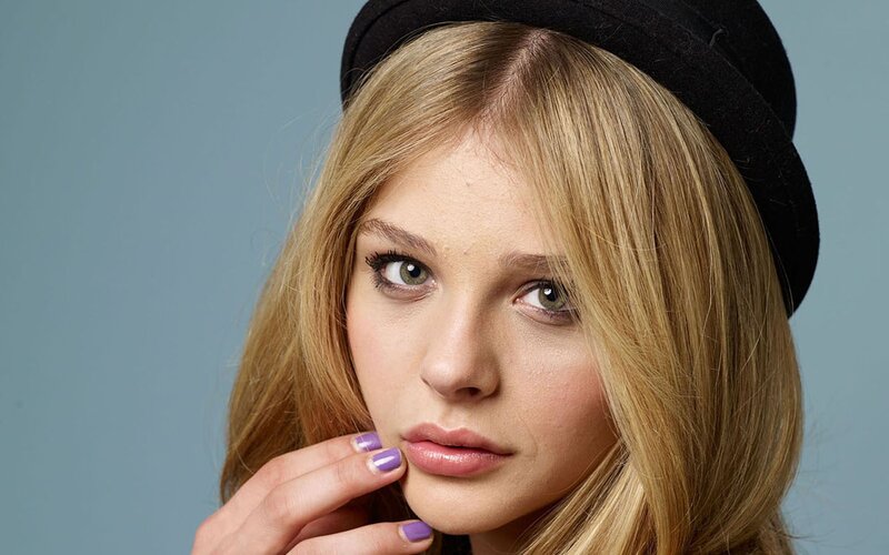 Woman with Blonde Hair — Neutral, Photograph, Black Hat, Purple Nails