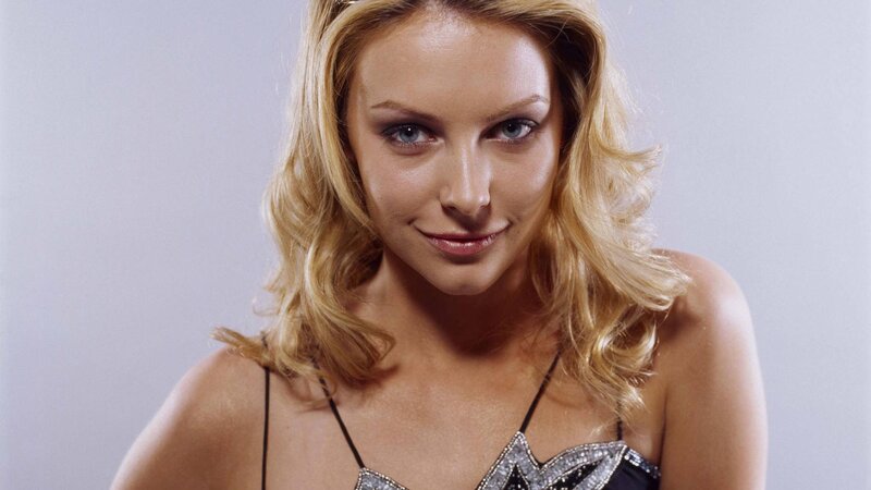 Woman with Blonde Hair — Neutral, Photograph, Blonde Hair, Black Top, Studio Background, White