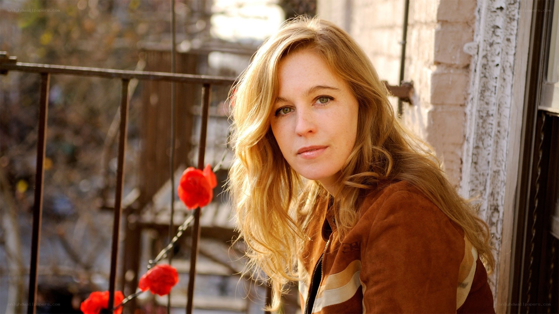 woman with blonde hair on balcony