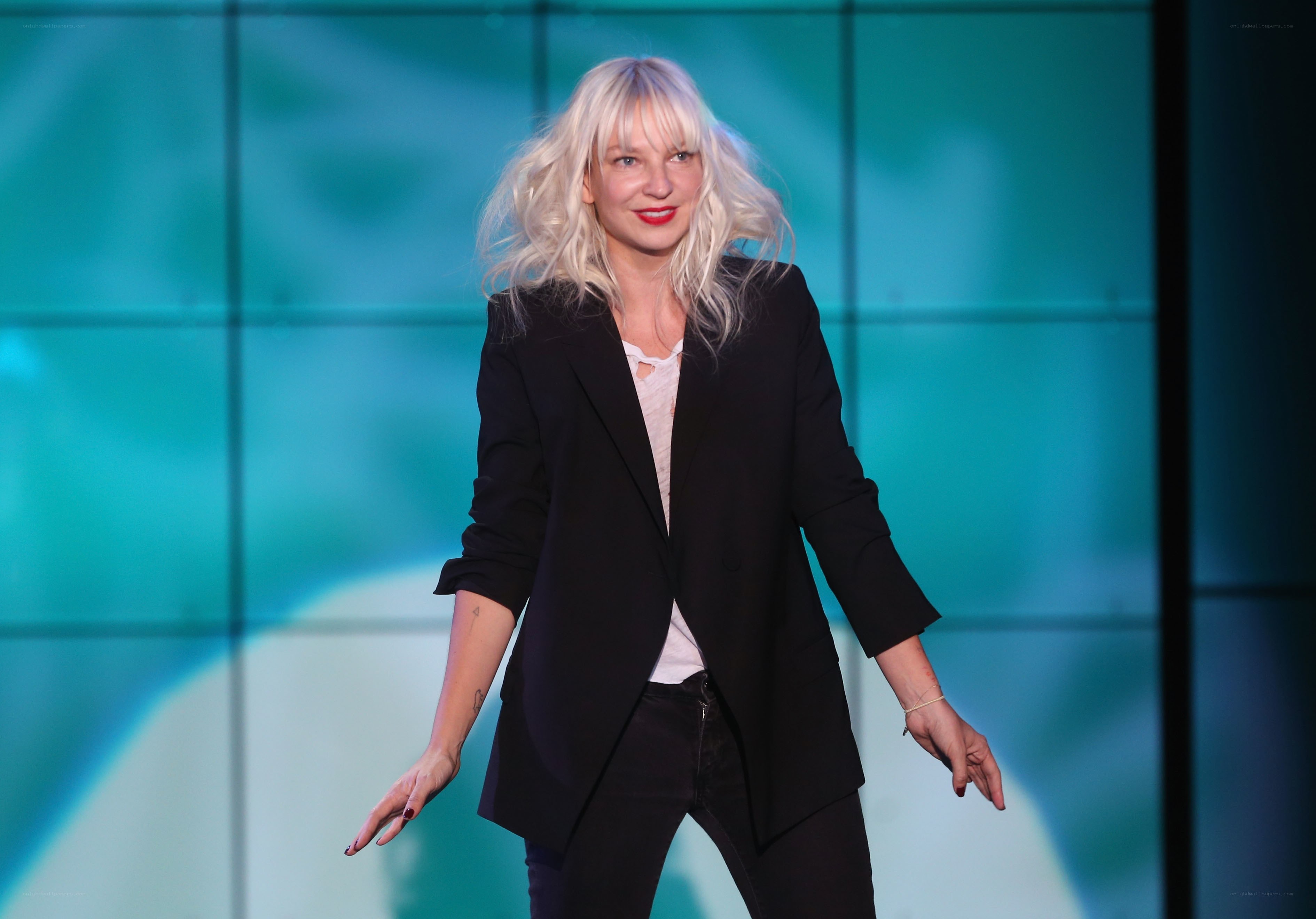 Woman with blonde hair on stage