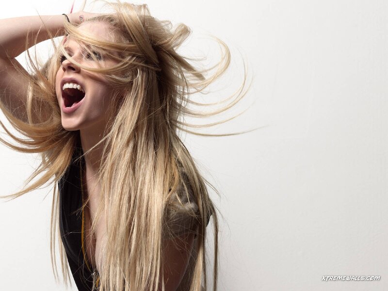 woman with blonde hair singing