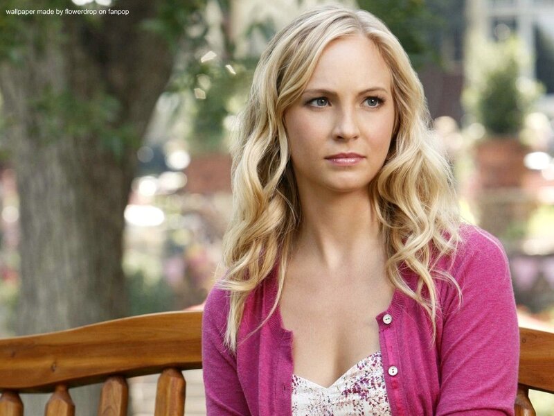 woman with blonde hair sitting on a bench