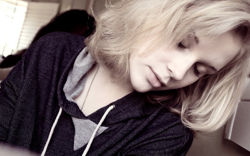 woman with blonde hair sleeping