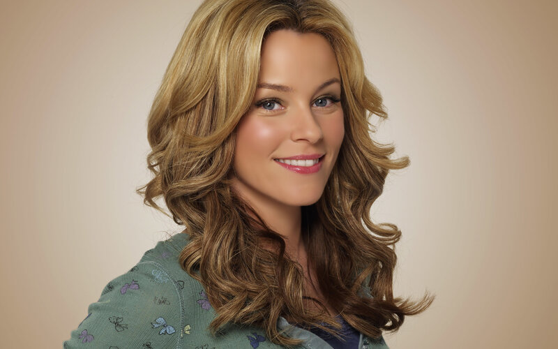 woman with blonde hair smiling