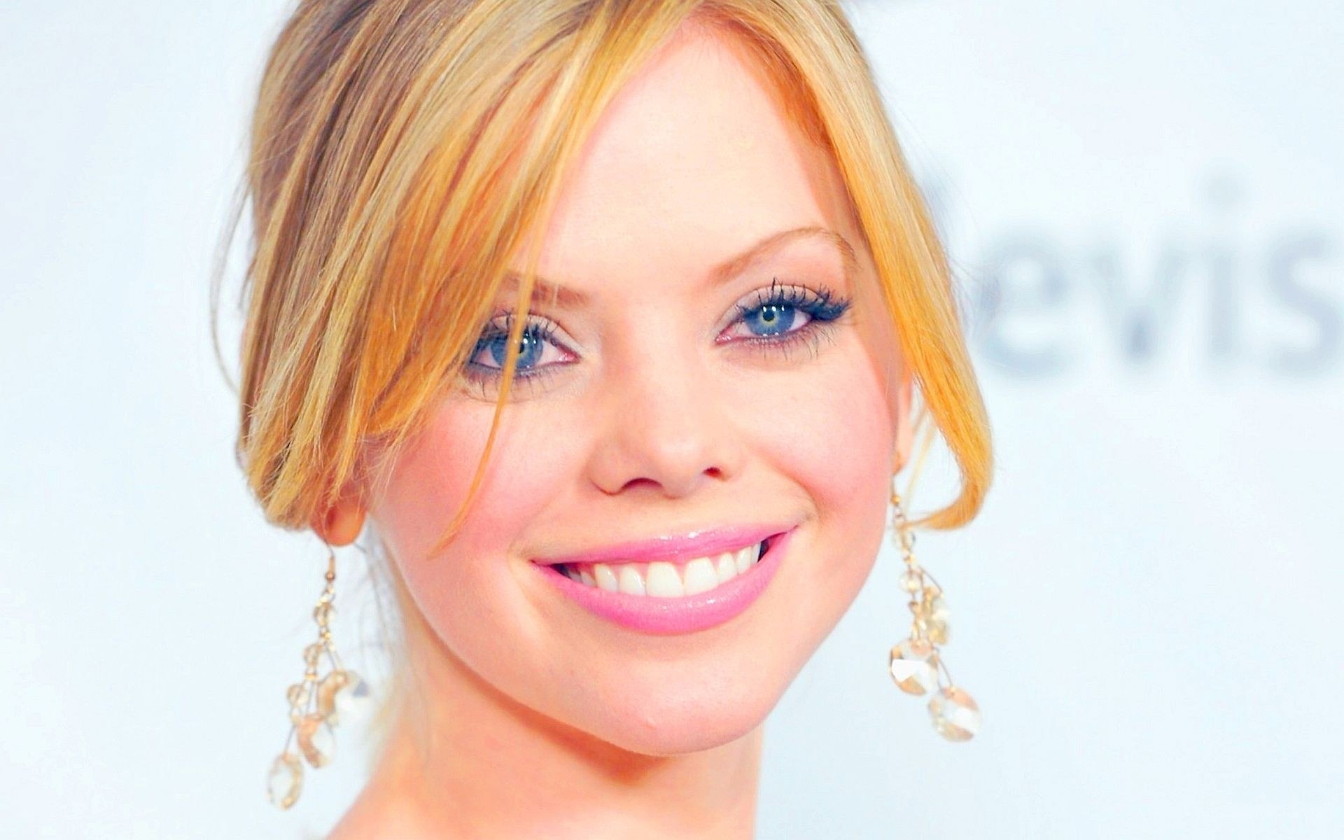woman with blonde hair smiling