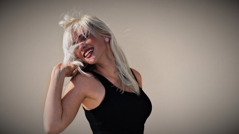 woman with blonde hair smiling