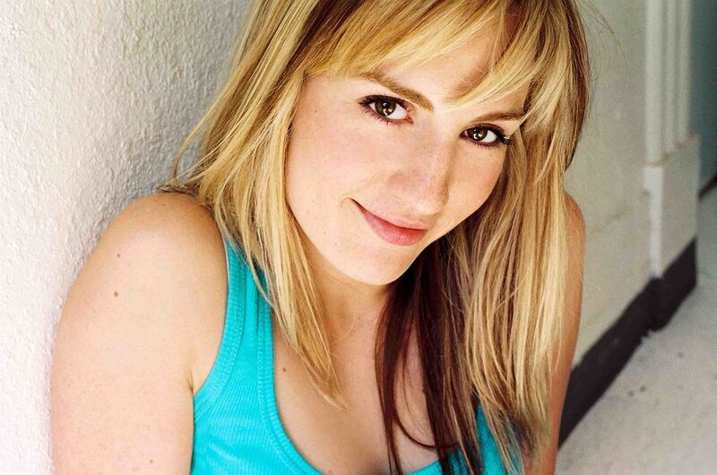 woman with blonde hair smiling