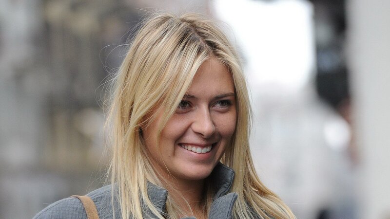 woman with blonde hair smiling