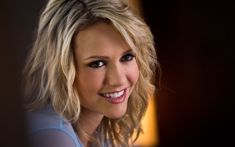 woman with blonde hair smiling
