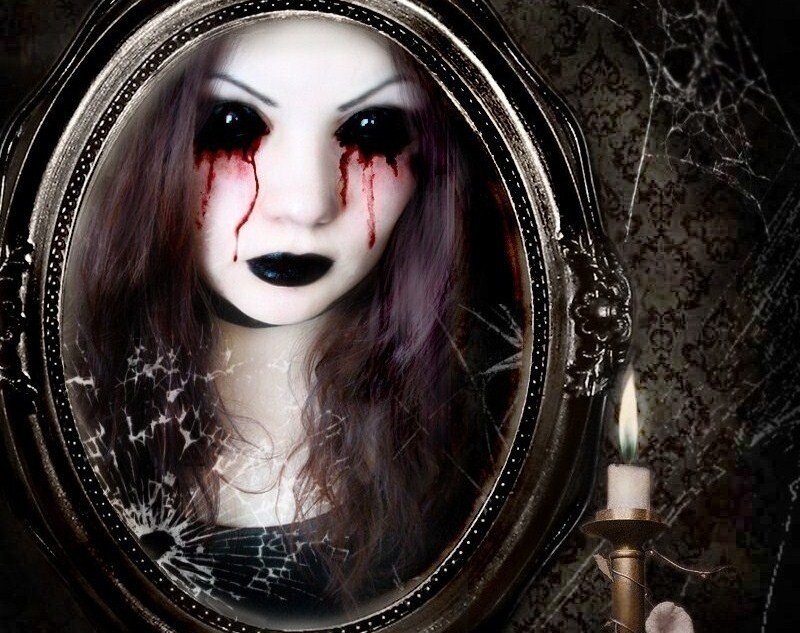 woman with blood tears in mirror
