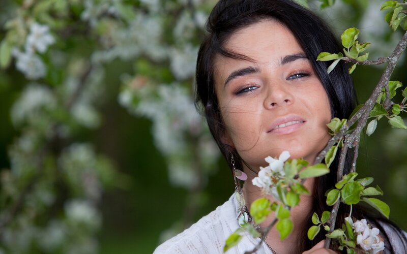 woman with blossoming tree