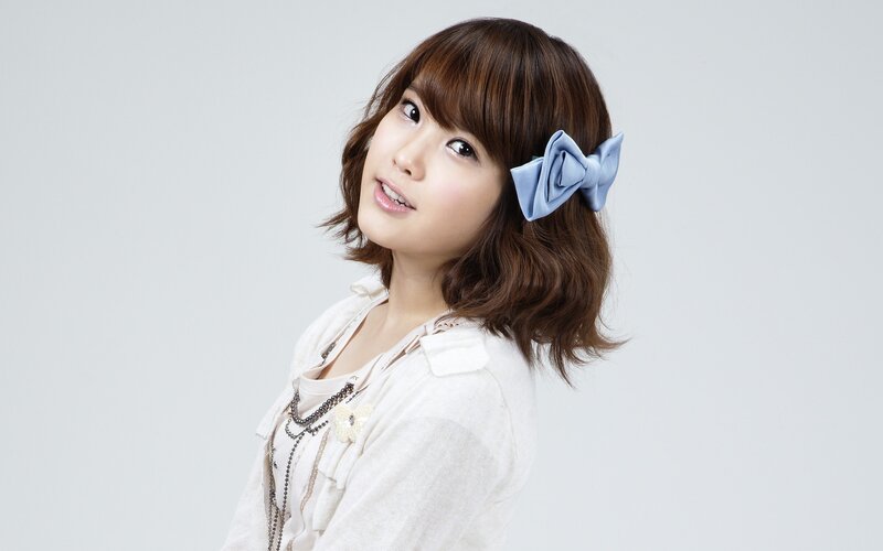 Woman with Blue Bow — White, Neutral, Photograph