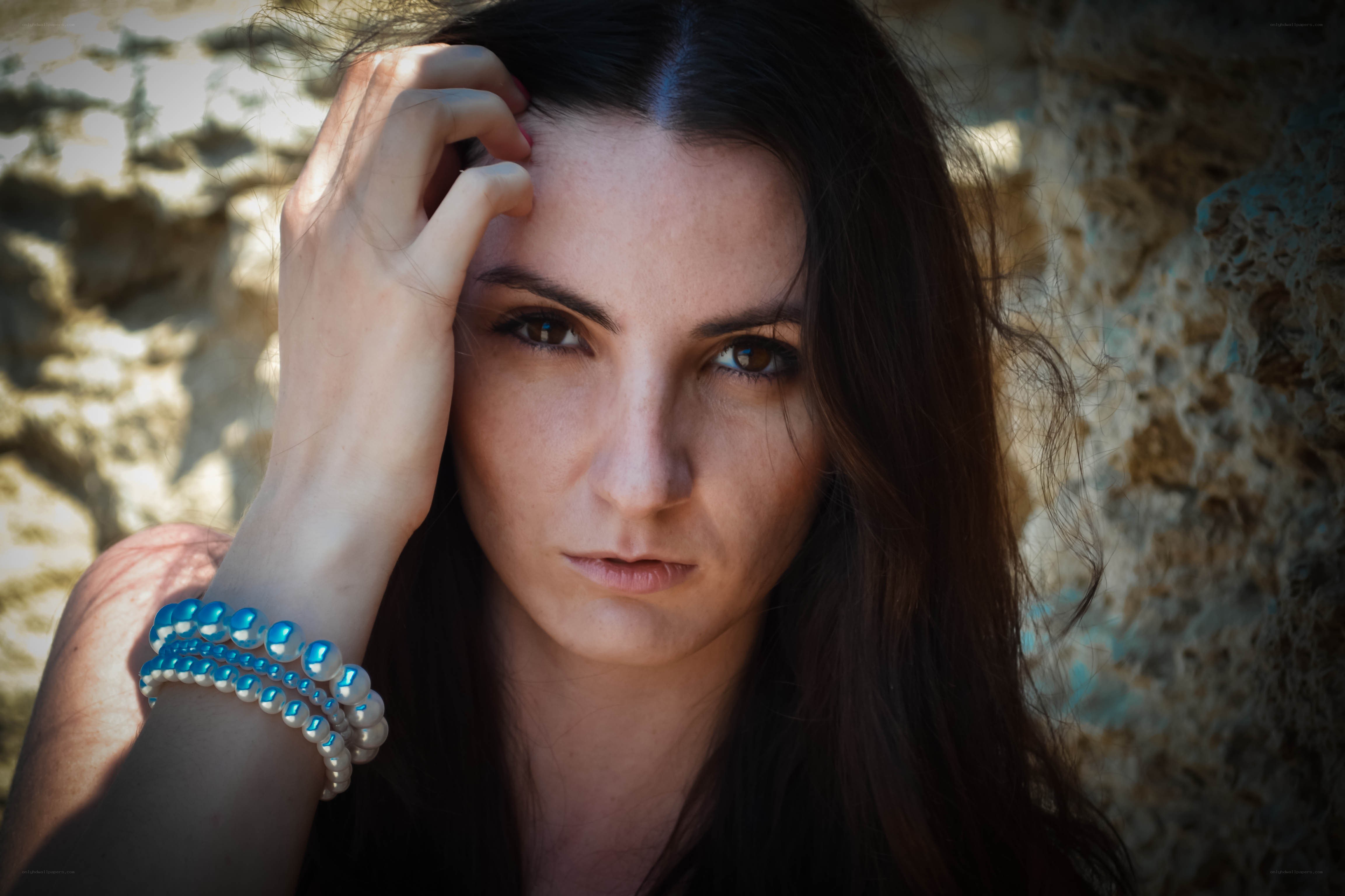 woman with blue bracelets