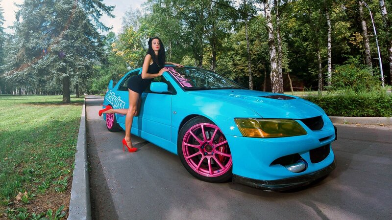 woman with blue car