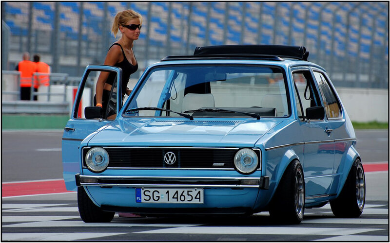 Woman with blue car on track