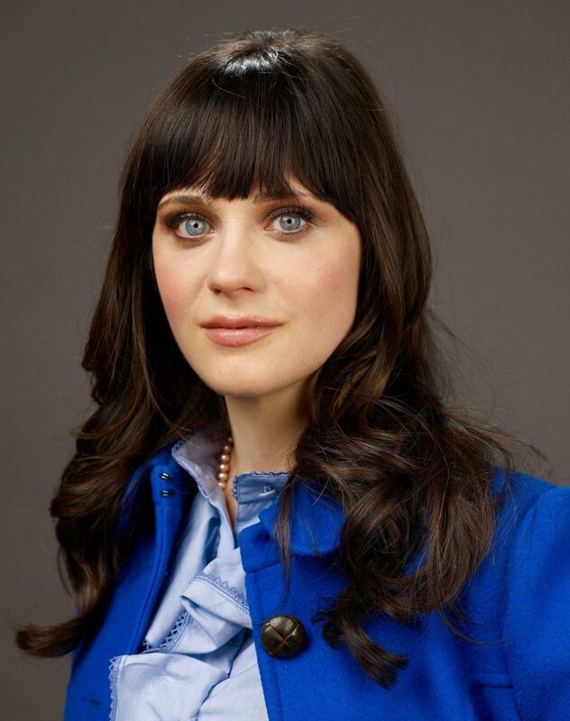 woman with blue coat and bangs