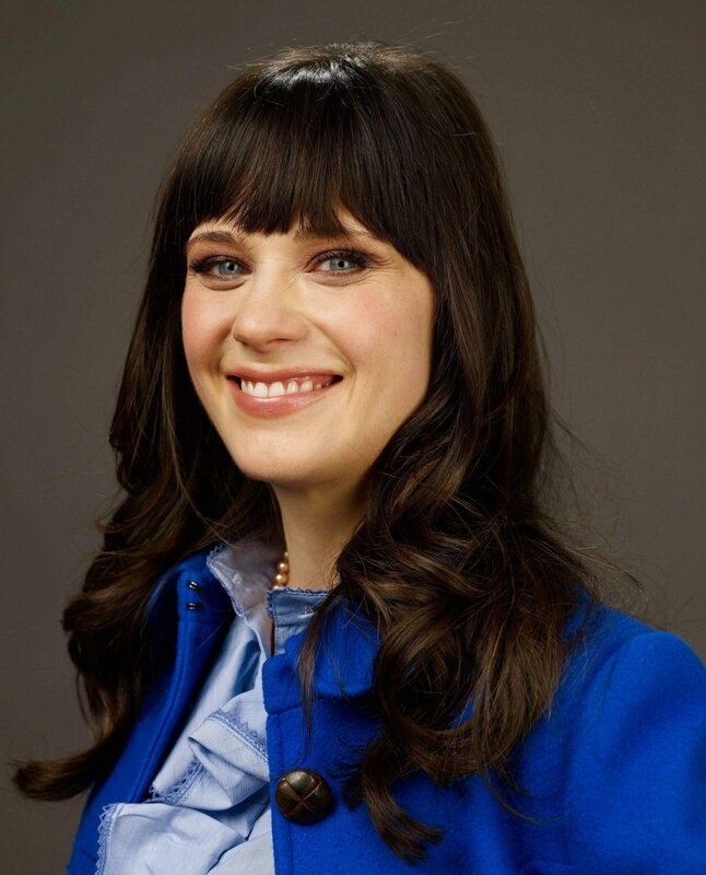 woman with blue coat smiling