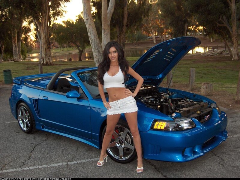 Woman with blue convertible car