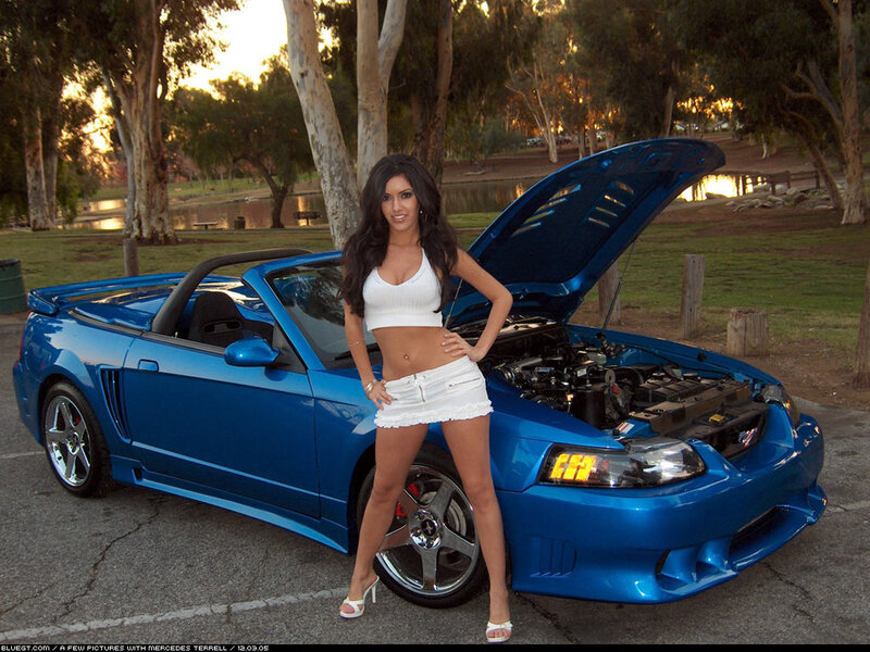 Woman with blue convertible car