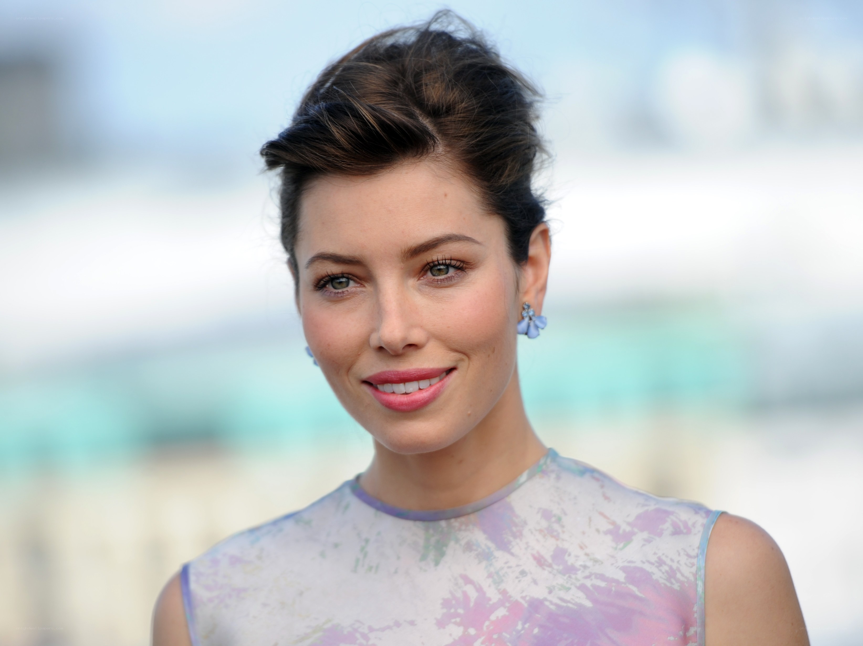 woman with blue earrings