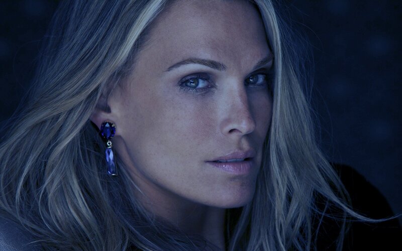 woman with blue earrings