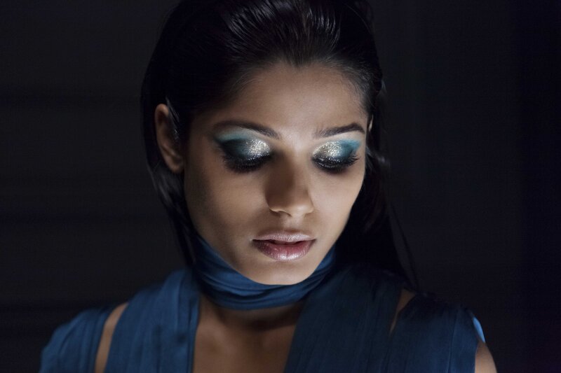 woman with blue eye makeup
