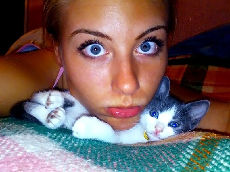 Woman with blue-eyed kitten