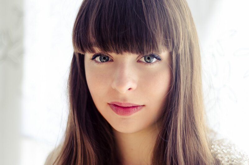 woman with blue eyes and bangs