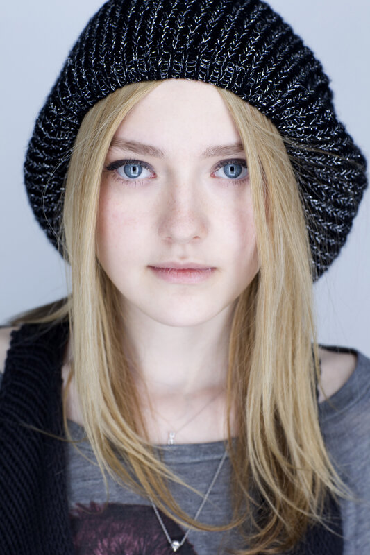 woman with blue eyes and beanie