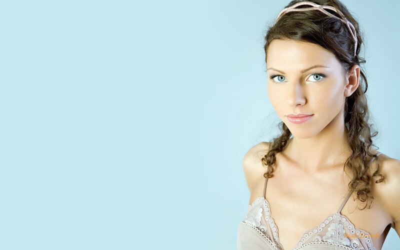 woman with blue eyes and braided hair