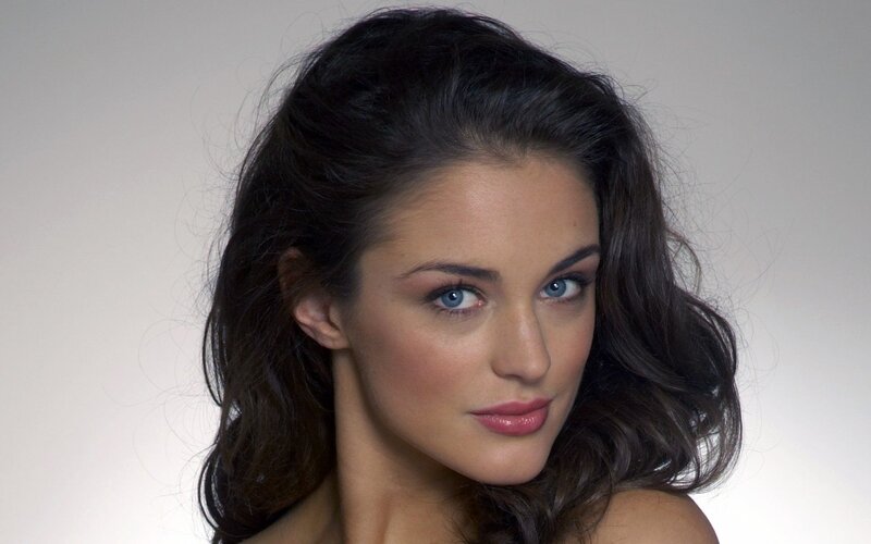woman with blue eyes and dark hair