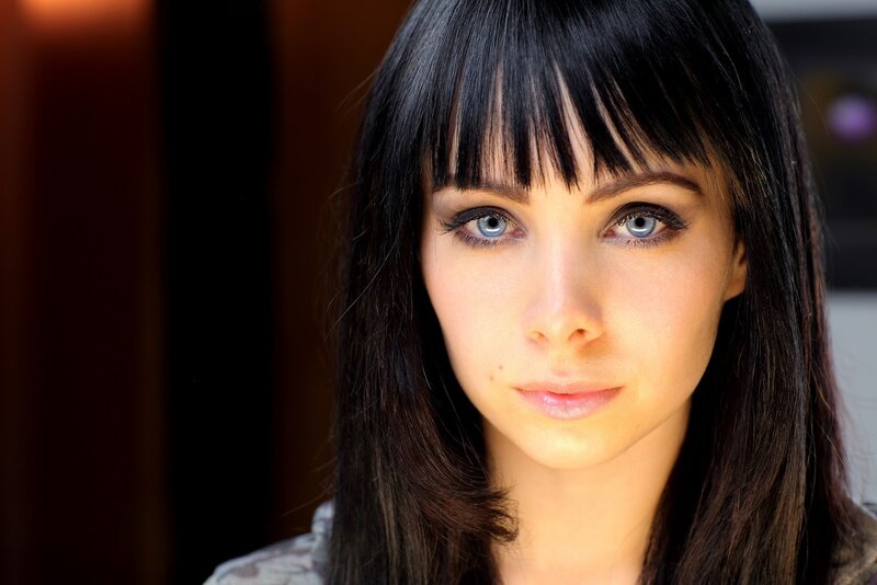 woman with blue eyes and dark hair