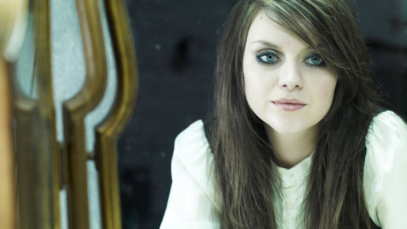 woman with blue eyes and dark hair