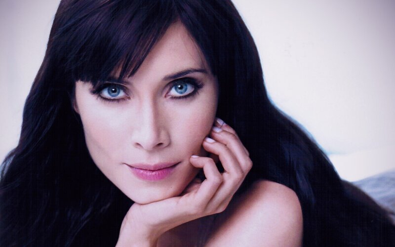 woman with blue eyes and dark hair