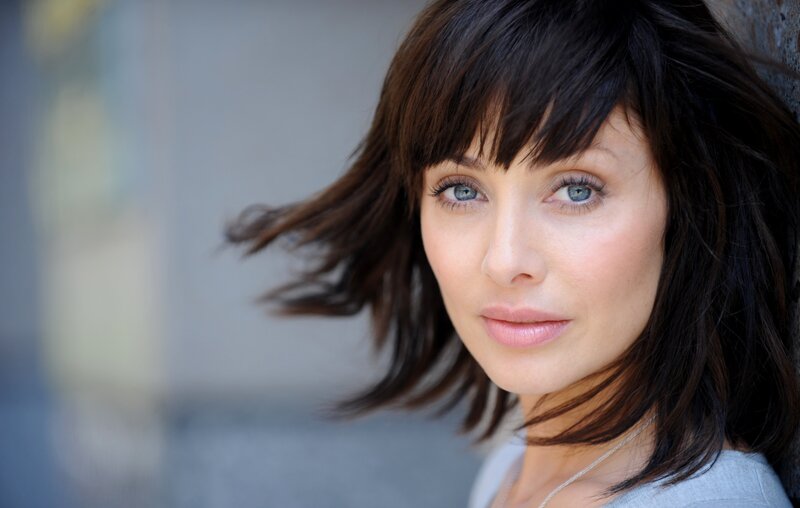 woman with blue eyes and dark hair