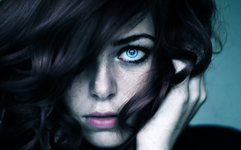 woman with blue eyes and dark hair