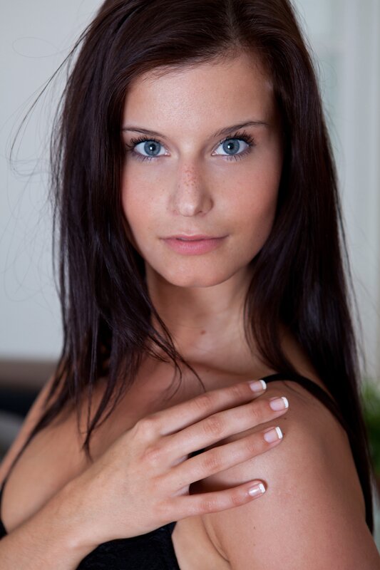 woman with blue eyes and dark hair