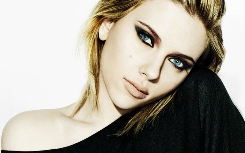 woman with blue eyes and dark makeup